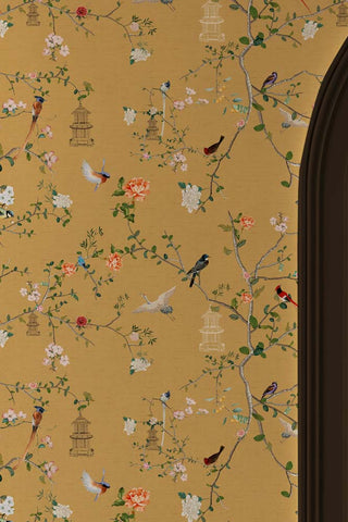 Close up of The Secret Garden Chinoiserie Wallpaper in Golden Hour against the frame of a door. 