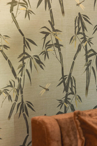 Detail of the The Wham Bamboo Wallpaper in Sage Green above a bed.