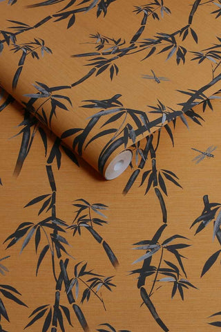 The roll of The Wham Bamboo Wallpaper in Golden Hour Noir.