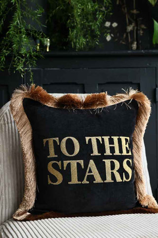 Lifestyle image of the To The Stars Velvet Fringe Feather Filled Cushion