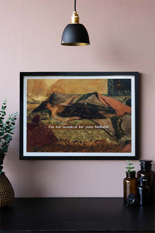 The Too Magical Art Print displayed on a light wall, surrounded by various homeware accessories and a plant.