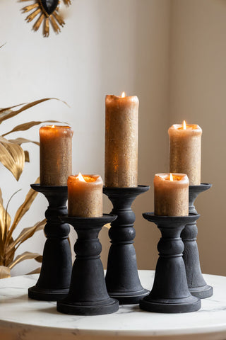 Image of the Traditional Black Candle Holder - Tall with lit candles