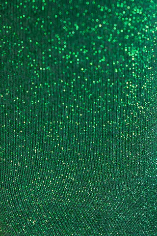 A detail shot showing the glitter detailing on the fabric of the Traitor Green Glitter Socks. 