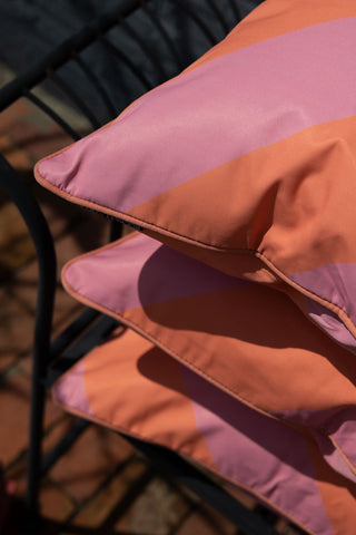 Close-up image of the Pink & Coral Stripe Outdoor Garden Cushion