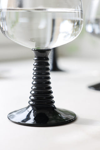 Close-up image of the 70s French Style Wine Glass In Black
