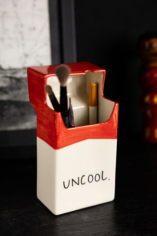 Lifestyle image of the Uncool Cigarette Packet Ceramic Ornament