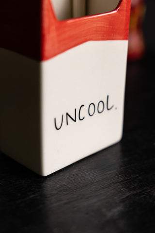 Close-up image of the Uncool Cigarette Packet Ceramic Ornament