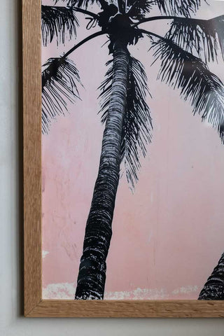 Detail image of Vintage Pink Palms 50cm x 50cm Art Print in a natural frame on a light background.