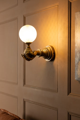 Image of the Vintage-Style Hand Wall Light with the light on