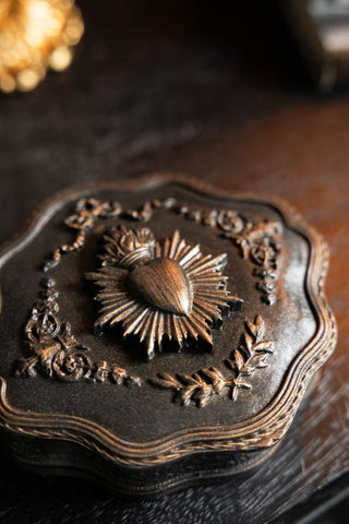 The lid of the Vintage-Style Milagro Heart Trinket Box. 