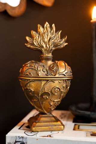 The Vintage-Style Milagro Trinket Dish styled on top of a book. 