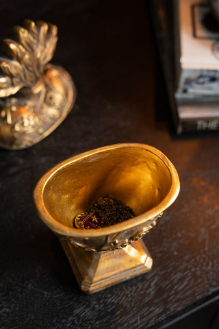 The hidden storage compartment in the Vintage-Style Milagro Trinket Dish. 