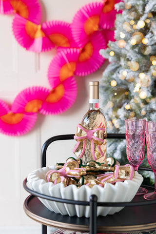 Image of the Vintage-Style Pink Bow Glass Christmas Tree Decoration in a party setting