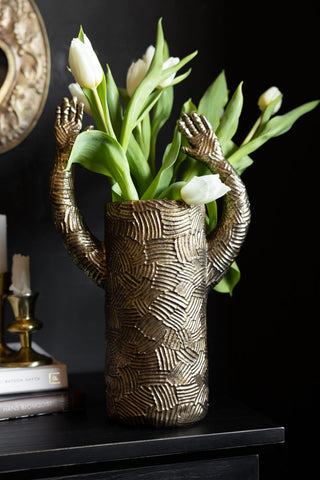 Lifestyle image of the Waving Arms Gold Vase