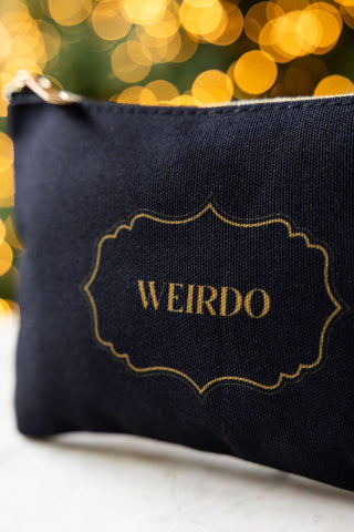 Close up detail of the text on the Weirdo Black Canvas Pouch. 