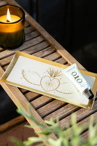 Lifestyle image of the White & Gold Milagro Heart Trinket Tray