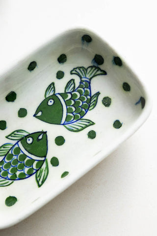 Close-up image of the White & Green Fish Ceramic Trinket Dish