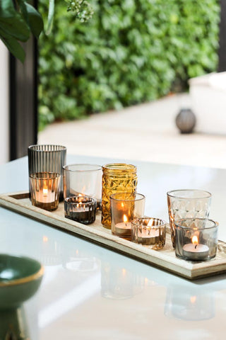 Lifestyle image of the Wooden Tray With Glass Candle Holder Votives