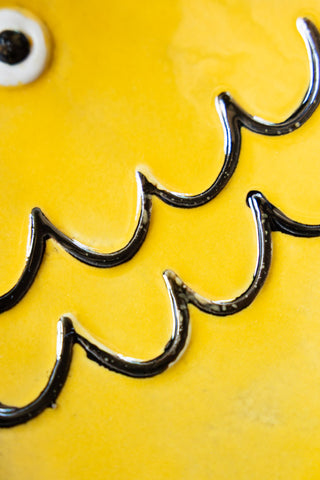 Close-up image of the Yellow Fish Display Dish