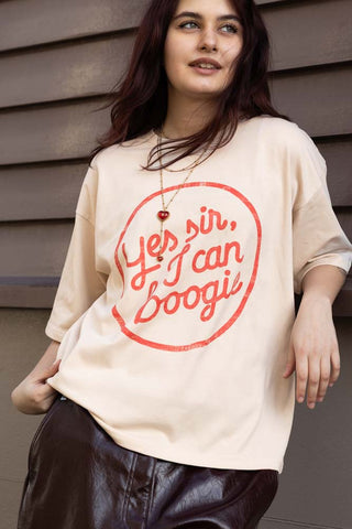 Lifestyle image of the Yes, Sir, I Can Boogie T-Shirt in Oat - Available in 6 Sizes