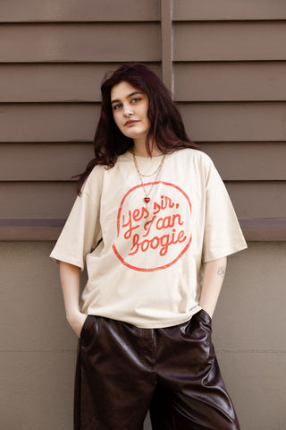 Image of a model wearing the Yes, Sir, I Can Boogie T-Shirt in Oat - Available in 6 Sizes