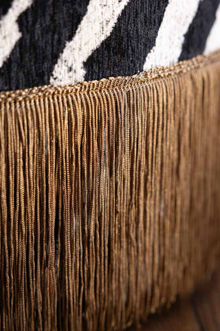 The gold fringe detail on the Zebra Print Tassel Footstool.
