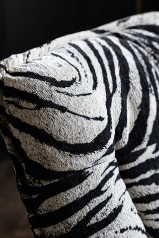 Close-up of the Zebra Print Velvet Swivel Chair.