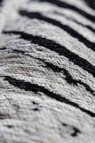 Close-up of the texture of the Zebra Print Velvet Swivel Chair.