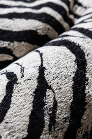 Close-up of the print of the Zebra Print Velvet Swivel Chair.