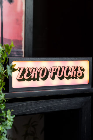 Lifestyle image of the Zero Fucks Light Box