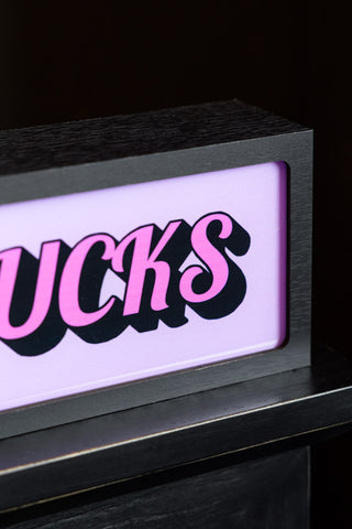 Close-up image of the Zero Fucks Light Box