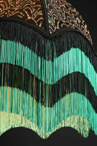 Close up of the Art Deco black shade with a teal and black fringing.