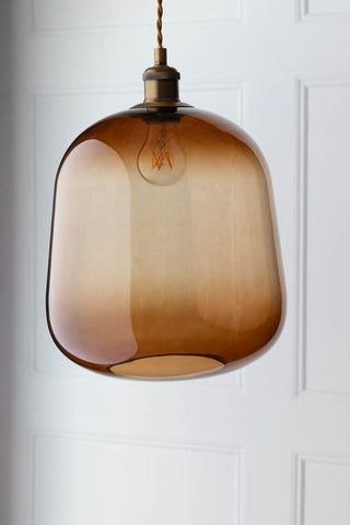 Lifestyle image of the Large Burnt Butterscotch Glass Ceiling Light