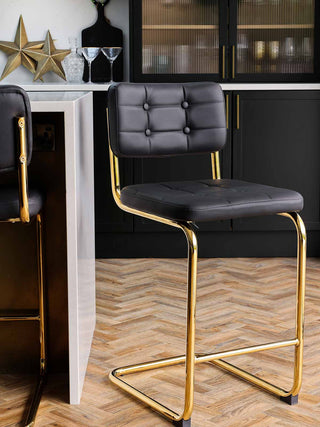 Black bar stool in a kitchen setting 