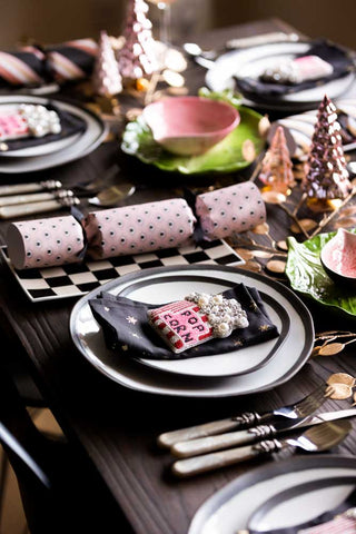 A festive dinner spread with the black and white plates.
