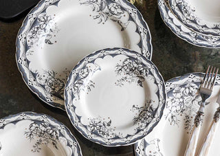 The 12-Piece Vintage-Style Floral & Star Dinner Set styled with a knife and fork.