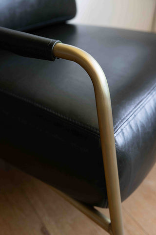 Close-up image of the Dark Green Leather Club Chair