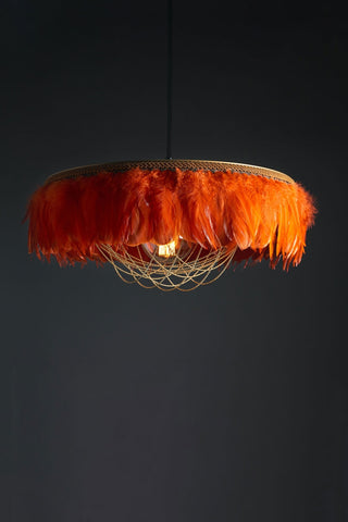 Image of the Juliette Fabulous Feather Chandelier Featuring Chains in Burnt Orange on a dark background