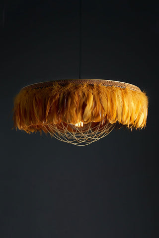 Image of the Juliette Fabulous Feather Chandelier Featuring Chains in Mustard Yellow on a dark background