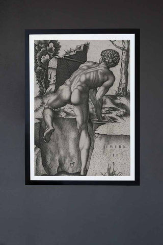 A black and white renaissance style art print of a naked man and the words "twerk it" in a black frame and hung on a grey wall.
