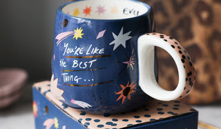 The You're Like The Best Thing Mug displayed on its printed packaging on a kitchen worktop.