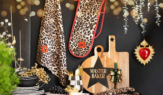 Various kitchen accessories styled with decorative accessories and greenery.