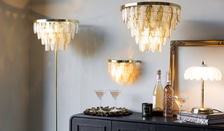 Four glass lights styled around a sideboard.