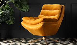 Image of the bold mustard reclining armchair in a dark room.