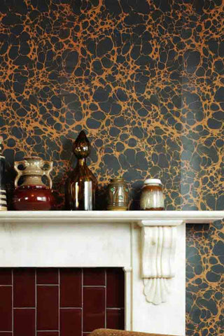 Image of marble effect wallpaper on a fireplace wall with a large marble fireplace in the image. 