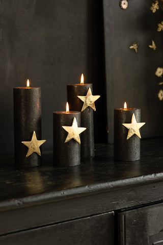 Image of the Set Of 4 Gold Star Pillar Candle Pins on black pillar candles