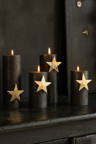 Lifestyle image of the Set Of 4 Gold Star Pillar Candle Pins