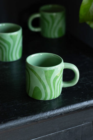 Close-up image of the Small Green Abstract Marble Mug