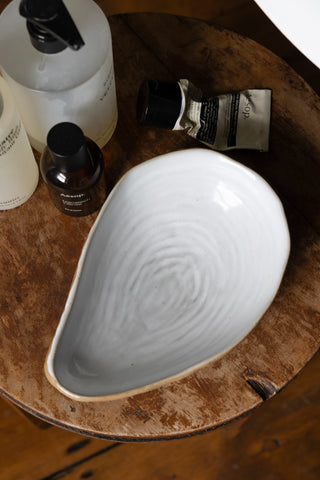 Lifestyle image of the Oyster Shell Dish in a bathroom setting