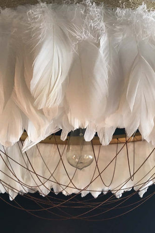 detail image of Fabulous Feather Chandelier Featuring Chains - Gloria - White with dark wall background